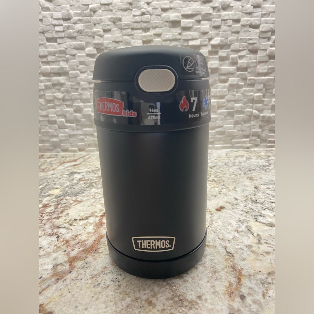 Brand new thermos with spoon